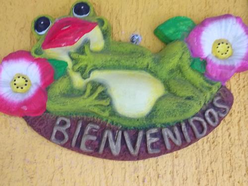 a cake shaped like a bird with flowers on it at Casa Palagui Colonial in Valladolid