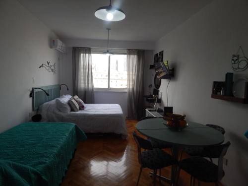 En eller flere senge i et værelse på Apio Studio Centro