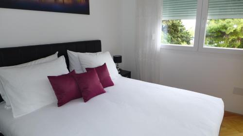 Postel nebo postele na pokoji v ubytování Apartment Spartium Split