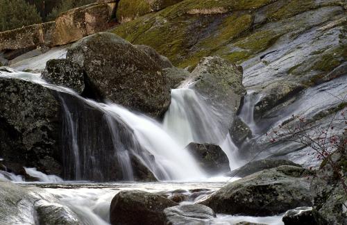 a stream of water flowing down a rocky waterfall at Lo Alto in El Arenal