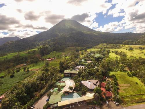 an aerial view of a village in front of a mountain at Baldi Hot Springs Hotel & Spa in Fortuna