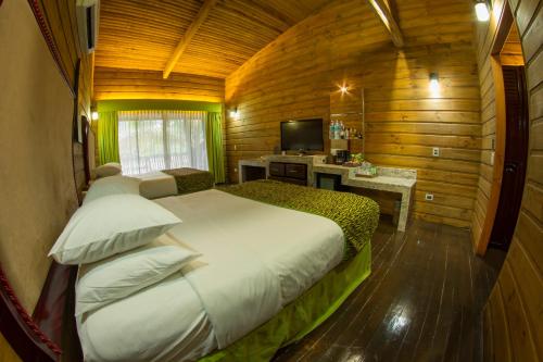 En eller flere senger på et rom på Baldi Hot Springs Hotel & Spa