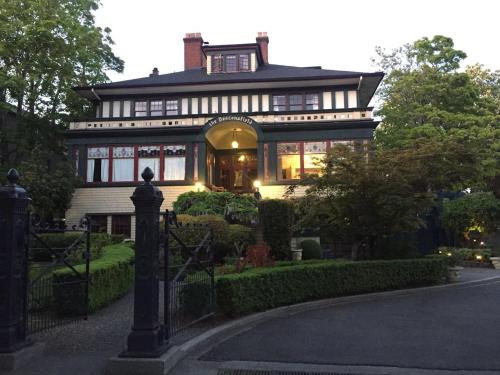 a large house with a gate in front of it at Beaconsfield Bed and Breakfast - Victoria in Victoria