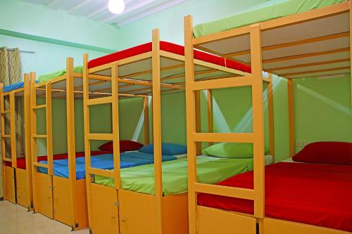 a group of bunk beds in a room at Antwet Backpacker's Inn & Rooftop Bar in Dumaguete