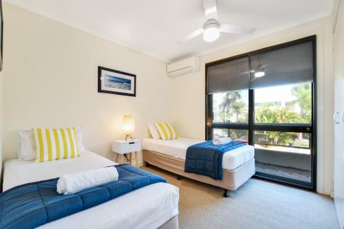 Postel nebo postele na pokoji v ubytování La Mer Apartments