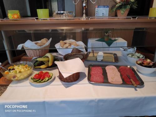 a table with different types of food on it at Hotel Steinhoff in Freden
