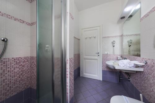 a bathroom with a sink and a shower at Ischia Dream Sunset in Ischia