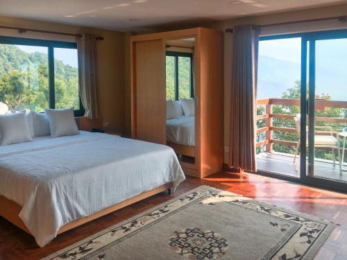 Ένα ή περισσότερα κρεβάτια σε δωμάτιο στο Belgian Hotel Pvt. Ltd