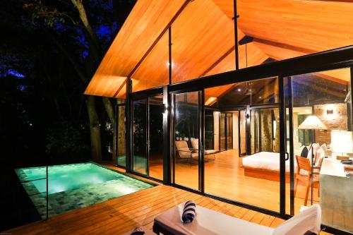 an external view of a house with a swimming pool at Kalundewa Retreat in Dambulla