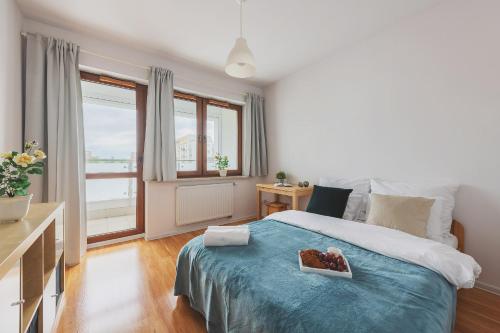 Posteľ alebo postele v izbe v ubytovaní P&O Apartments Namyslowska