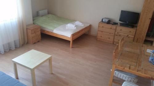 Llit o llits en una habitació de apartament muszelka