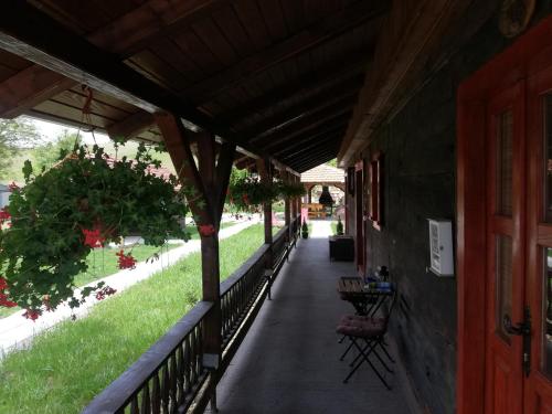 a porch of a building with a walk way at Pod orehom drvena kuća i sauna in Krapina