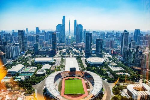 an aerial view of a baseball stadium with a city at Paco Hotel Tiyuxilu Metro Guangzhou-Free Shuttle Bus during Canton Fair&5 Min walk to Canton Fair Buyer Registration Store in Guangzhou