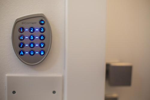 a remote control attached to a wall at SuitesGaribaldi in Cagliari