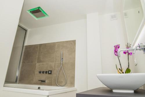 a bathroom with a shower and a sink at SuitesGaribaldi in Cagliari