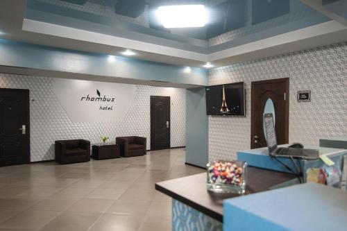 a lobby of a salon with a sign on the wall at Rhombus Hotel in Luts'k