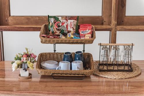 two baskets on a table with food and drinks at U Chiangkhan in Chiang Khan