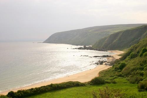 a view of a beach with the ocean at Wild Atlantic View Inishowen in Greencastle