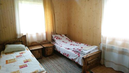 Postel nebo postele na pokoji v ubytování Lisowa Hatka