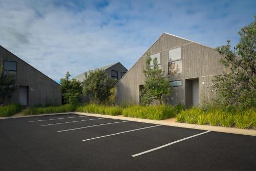 a parking lot in front of two buildings at Southern Ocean Villas in Port Campbell