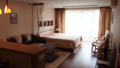 Ένα ή περισσότερα κρεβάτια σε δωμάτιο στο Pušynas Apartments