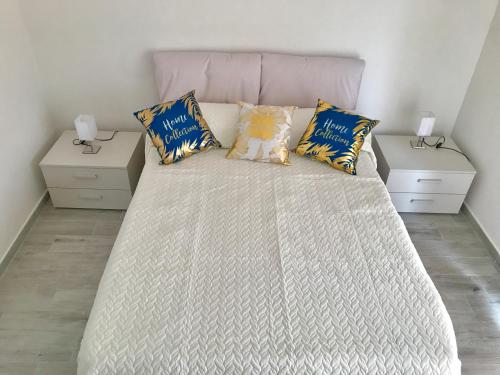 a bedroom with a large bed with two night stands at Roof Top 19 in Ventimiglia