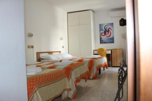 Postel nebo postele na pokoji v ubytování Hotel Derna