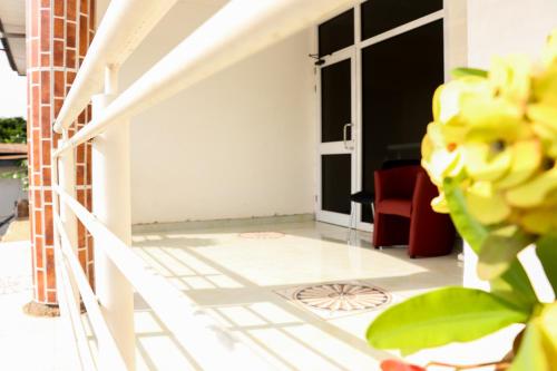 a view of a living room with a couch and a window at Bonsukoda Lodge in Accra