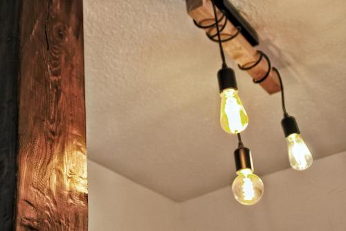 a group of lights hanging from a ceiling at La Fontaine - Studio Ecusson in Montpellier
