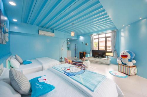 Llit o llits en una habitació de Quan World My Home B&B
