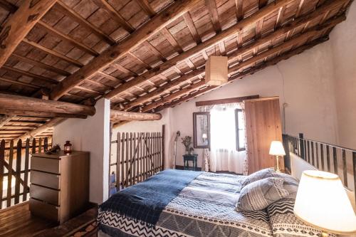 Postel nebo postele na pokoji v ubytování El Molino del Corcho