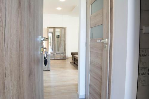 a door leading into a room with a hallway at Apartments Gerda in Vřesina