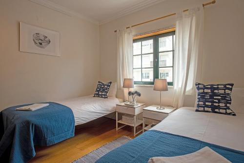 Ένα ή περισσότερα κρεβάτια σε δωμάτιο στο Carcavelos Surf