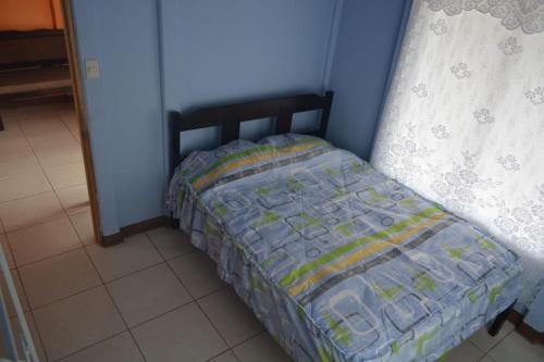 En eller flere senge i et værelse på Finca Eco-amigable La Amistad