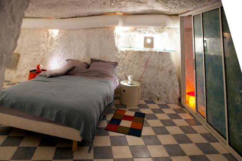 Postel nebo postele na pokoji v ubytování Gîte de l'oppidum