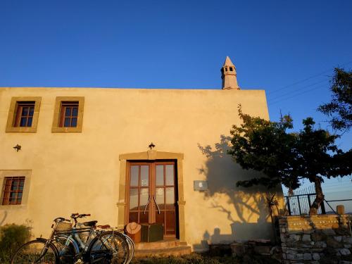 a group of bikes parked outside of a building at DonQuihotel Chalet in Karvounádhes