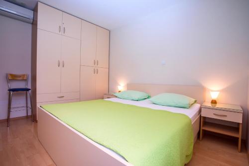 Кровать или кровати в номере Apartmani Ribnjak Seka