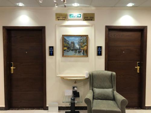 a waiting room with two doors and a chair at Bissau Royal Hotel in Bissau