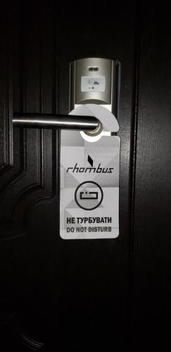 a sign on the door of a refrigerator at Rhombus Hotel in Luts'k