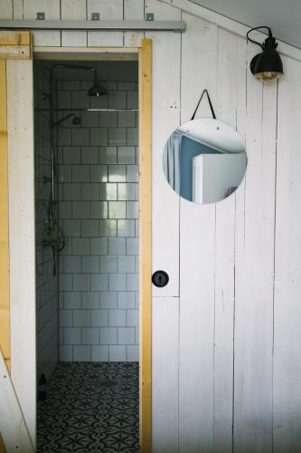 a bathroom with a sink and a mirror on the wall at Brännö Varv Bed & Breakfast in Brännö