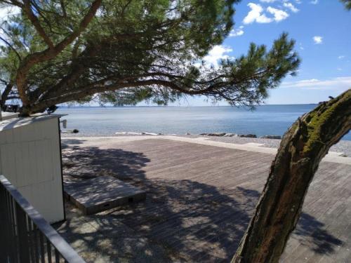 a view of the beach from the porch of a house at Casa Lenka in Málchina