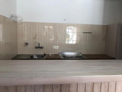 a kitchen with a sink and a counter top at Viviendas Ferrer-Es Mal Pas in Sant Francesc Xavier