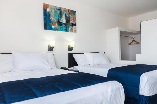 Postel nebo postele na pokoji v ubytování Hotel MB