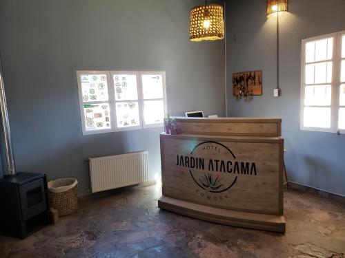 a room with a wooden box in the corner of a room at Hotel Jardin Atacama in San Pedro de Atacama