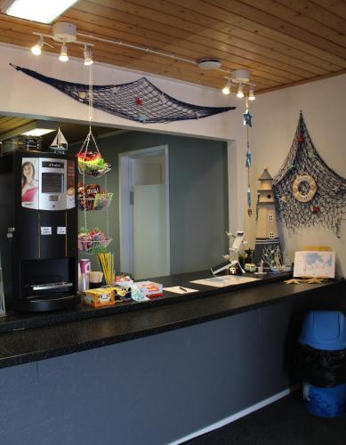 a kitchen with a counter with a large mirror at Eckerö Camping & Stugor in Eckerö