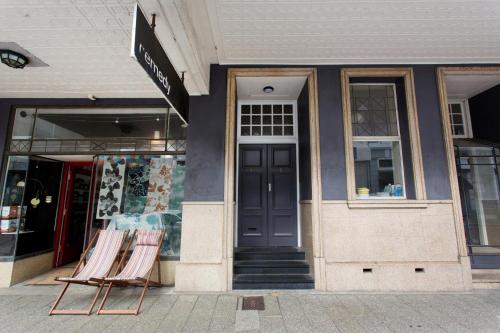a store front with two folding chairs outside of it at Hidden Treasure in Fremantle