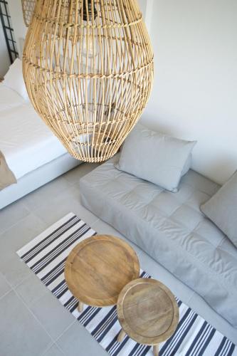 a living room with a couch and a chandelier at Alancia Suites in Sami