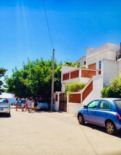 a blue car parked in front of a building at Relax Near The Sea in Noto Marina
