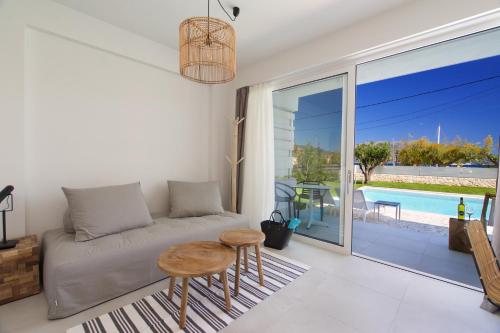 a living room with a couch and a table at Alancia Suites in Sami