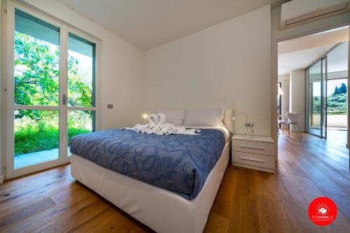 a bedroom with a bed and a large window at Paradise Luxury Terrace in Portovenere